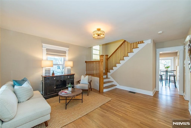 living room featuring light hardwood / wood-style floors and a wealth of natural light