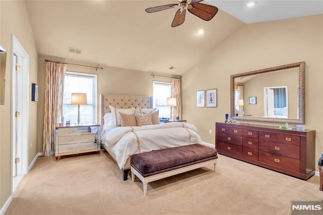 carpeted bedroom with ceiling fan, vaulted ceiling, and multiple windows