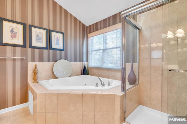 bathroom with separate shower and tub