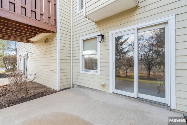 entrance to property with a patio area