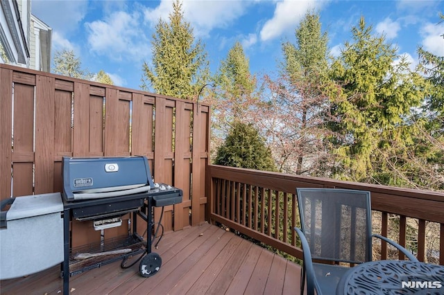 wooden terrace featuring grilling area