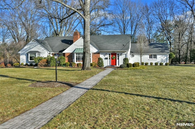 single story home featuring a front lawn