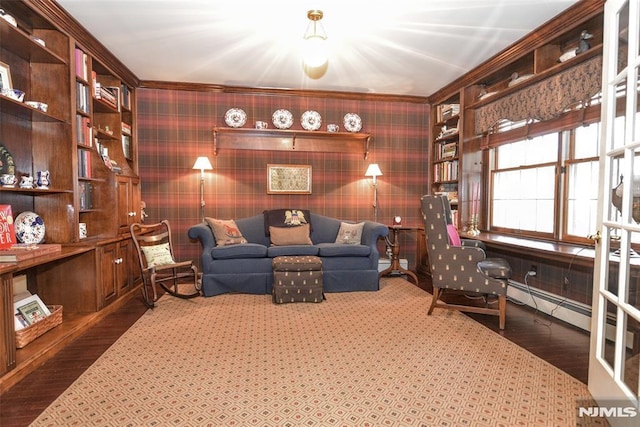 living area featuring hardwood / wood-style floors, a baseboard radiator, and ornamental molding