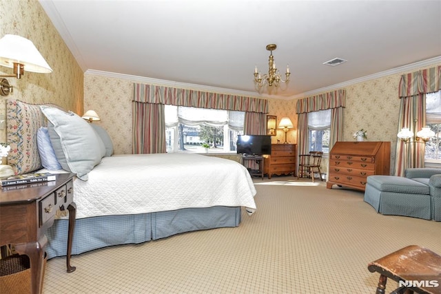 carpeted bedroom featuring crown molding and a chandelier