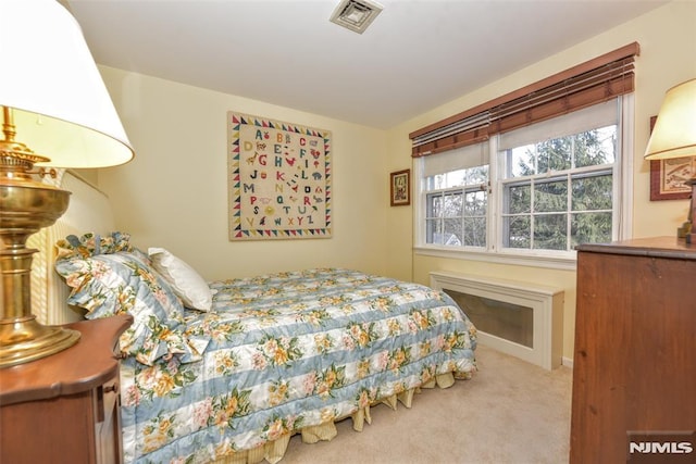 bedroom with light carpet