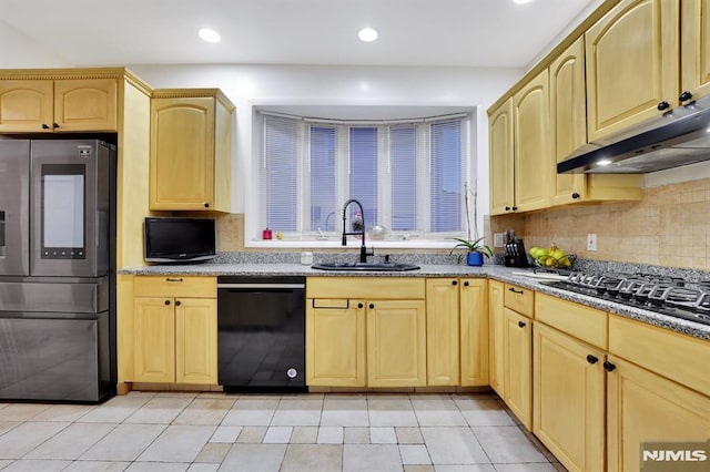 kitchen with light brown cabinetry, sink, light tile patterned flooring, black appliances, and decorative backsplash