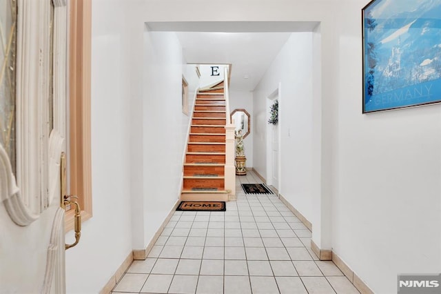 hallway featuring light tile patterned flooring