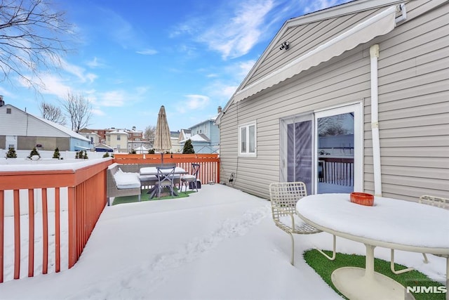 view of snow covered deck