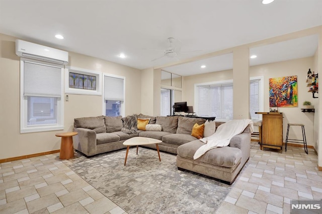 living room featuring a wall unit AC and ceiling fan