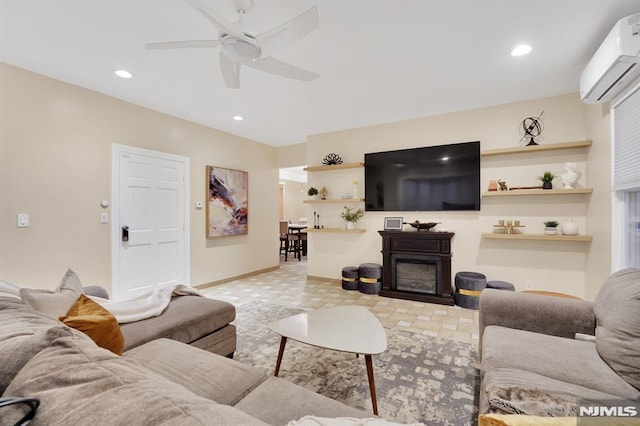 living room featuring a wall unit AC and ceiling fan