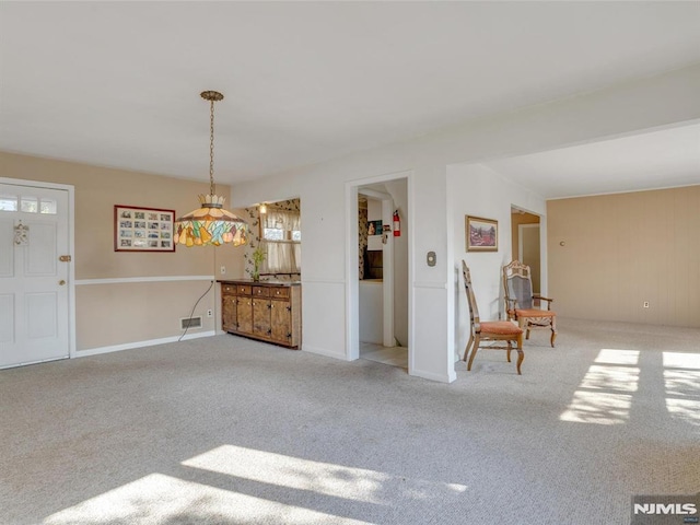 interior space featuring light carpet