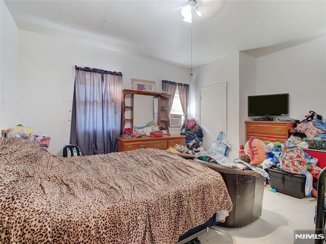 bedroom featuring ceiling fan and cooling unit