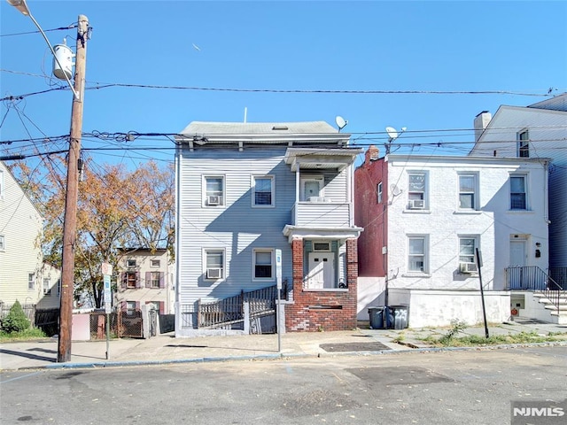 view of front of home featuring cooling unit