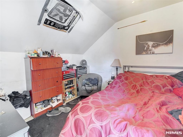 bedroom with lofted ceiling