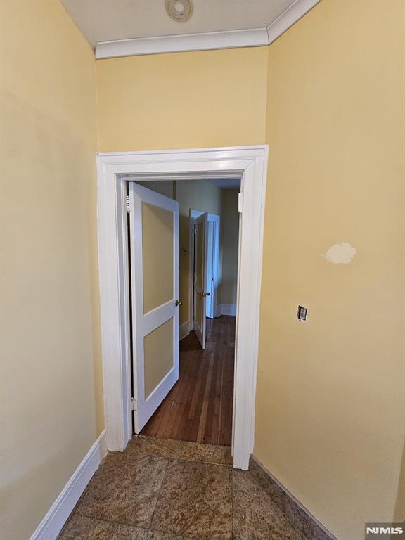 corridor with crown molding