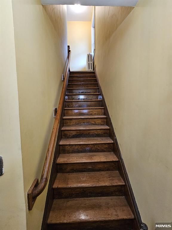 staircase with radiator