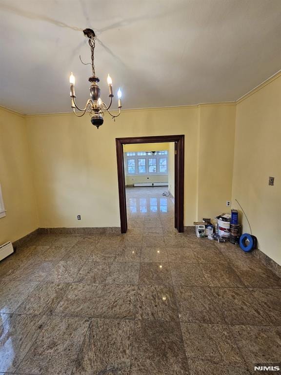 unfurnished dining area featuring an inviting chandelier and a baseboard heating unit