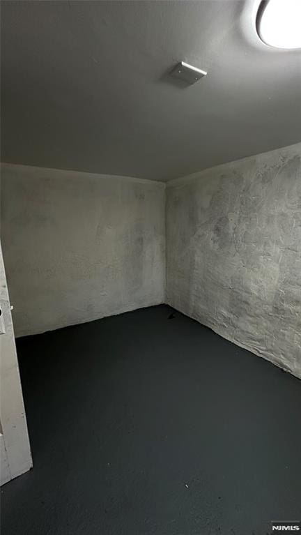 bonus room with concrete floors