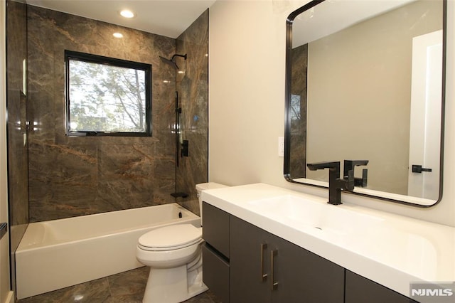 full bathroom with tile patterned floors, vanity, toilet, and tiled shower / bath