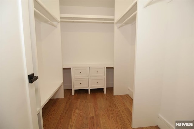 walk in closet featuring light wood-type flooring