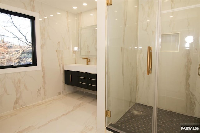 bathroom with vanity and walk in shower