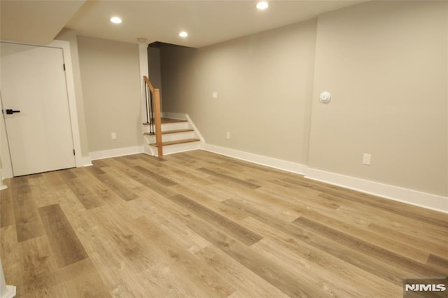 basement featuring light hardwood / wood-style floors