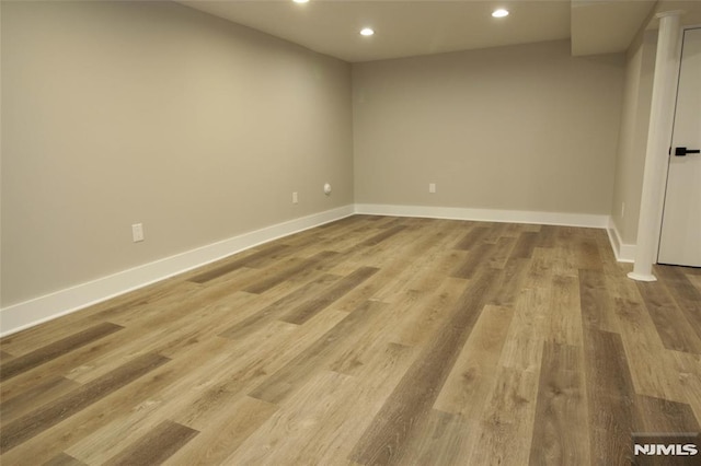 spare room with light wood-type flooring