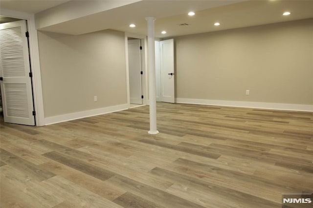 basement featuring light hardwood / wood-style floors