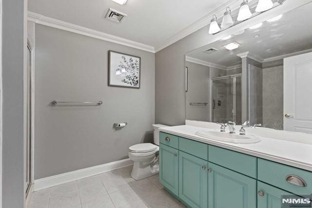 bathroom featuring toilet, vanity, tile patterned floors, ornamental molding, and a shower with shower door