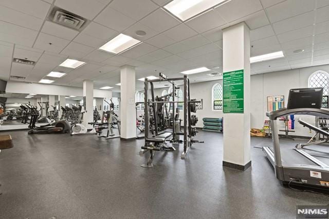 workout area with a drop ceiling