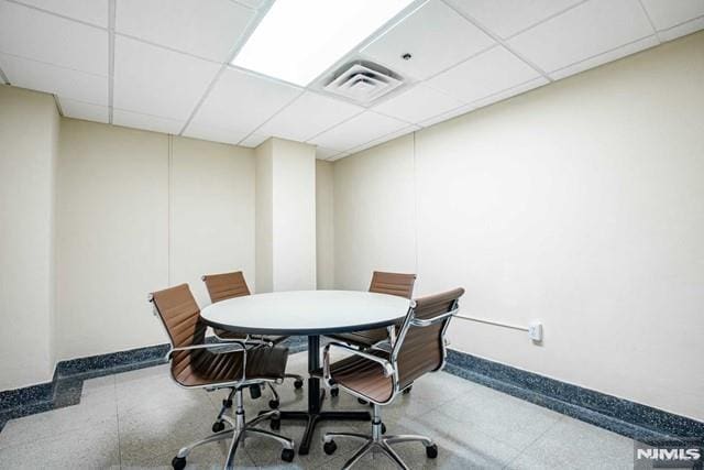 interior space featuring a paneled ceiling