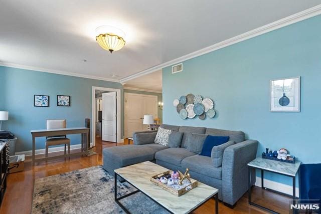 living room featuring crown molding and dark hardwood / wood-style floors