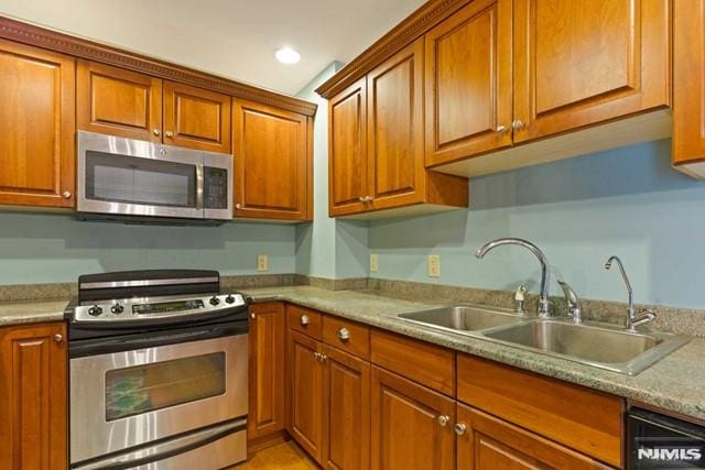 kitchen with sink and appliances with stainless steel finishes