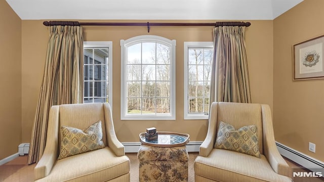 sitting room featuring baseboard heating