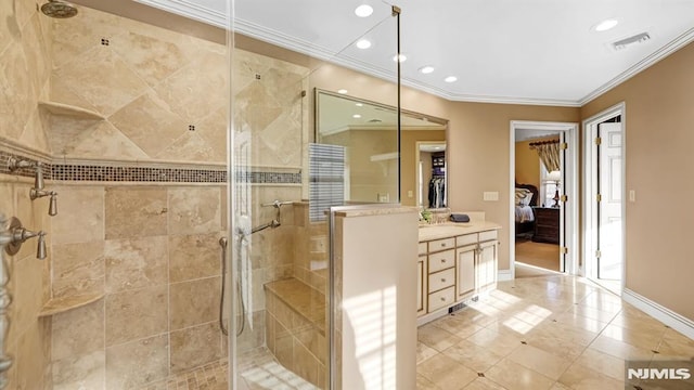 bathroom featuring vanity, tile patterned flooring, a shower with shower door, and ornamental molding