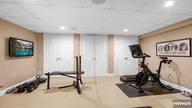 exercise room featuring light colored carpet