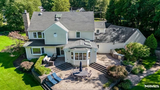 back of house with a patio area