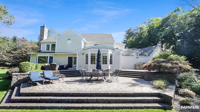 rear view of house with a patio