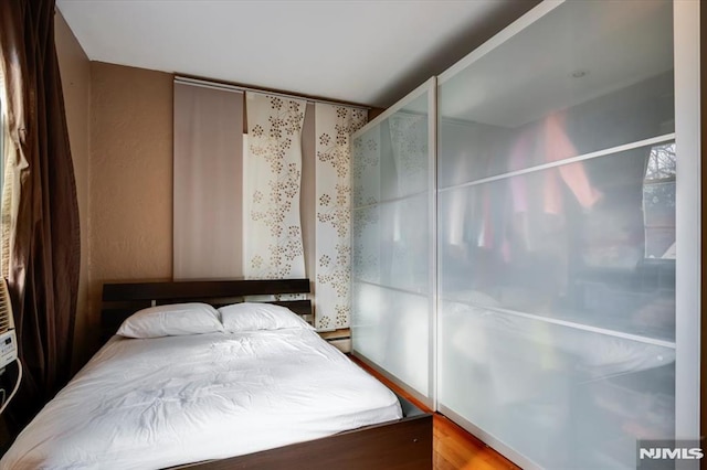 bedroom with wood-type flooring