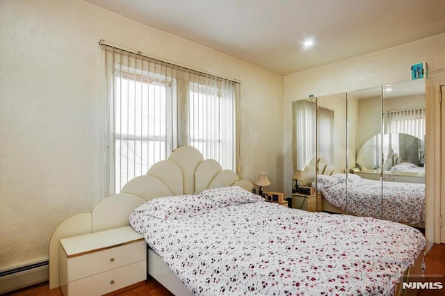 bedroom featuring baseboard heating