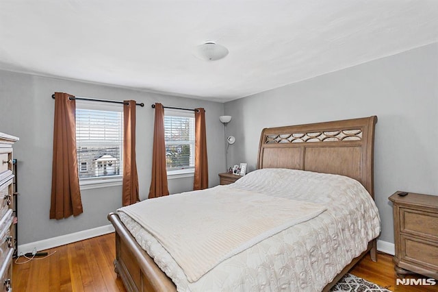 bedroom featuring dark wood-type flooring