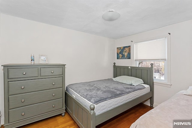 bedroom featuring hardwood / wood-style floors