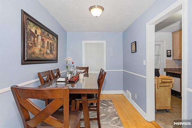 dining room featuring light wood-type flooring