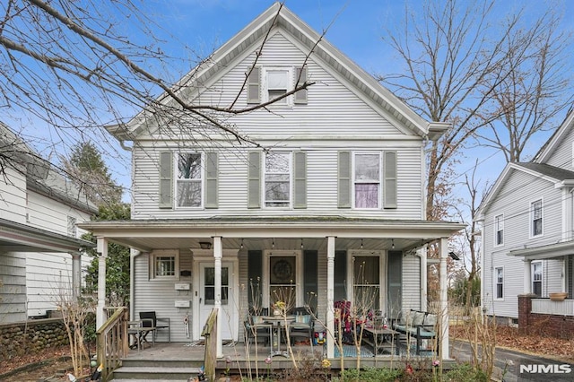 view of front property featuring covered porch