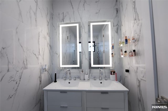 bathroom with tile walls and vanity