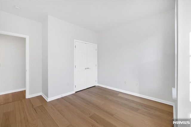 spare room featuring hardwood / wood-style floors