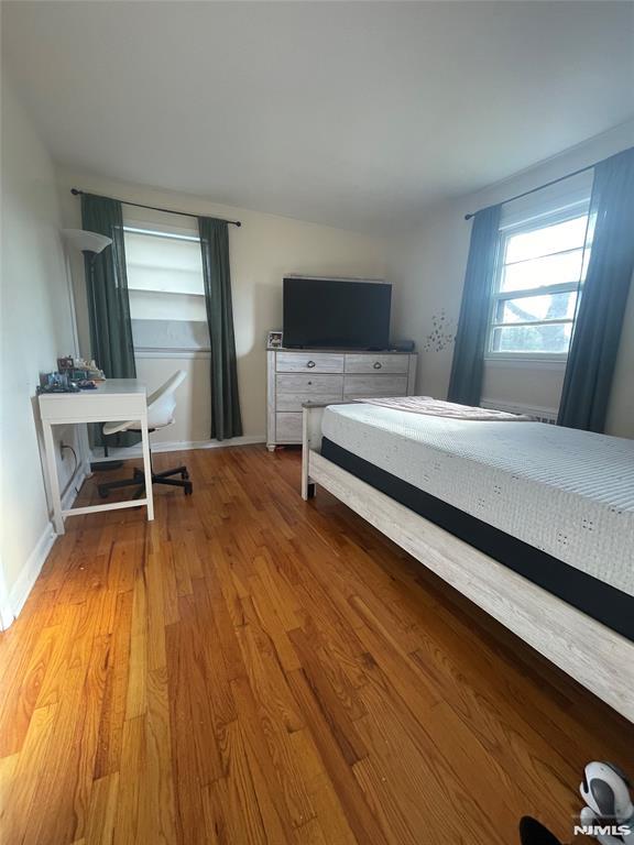 bedroom with wood-type flooring