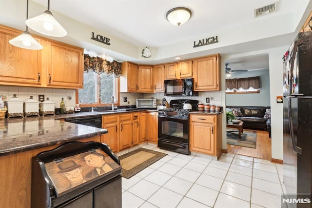 kitchen with ceiling fan, decorative light fixtures, light tile patterned flooring, and black appliances