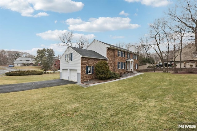 view of home's exterior featuring a yard and a garage