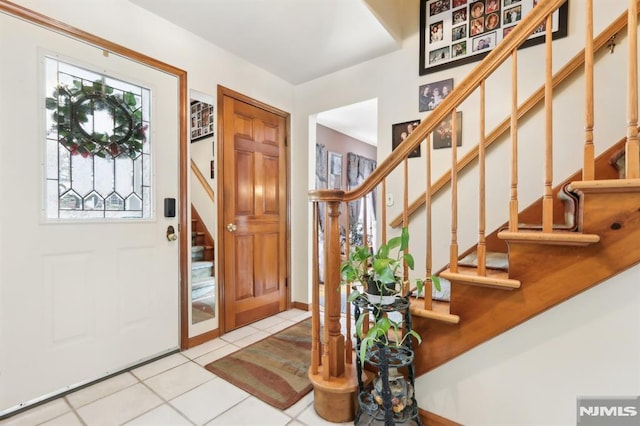 foyer with light tile patterned flooring